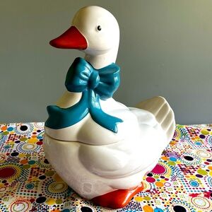 Vintage ceramic goose with blue bow cookie jar